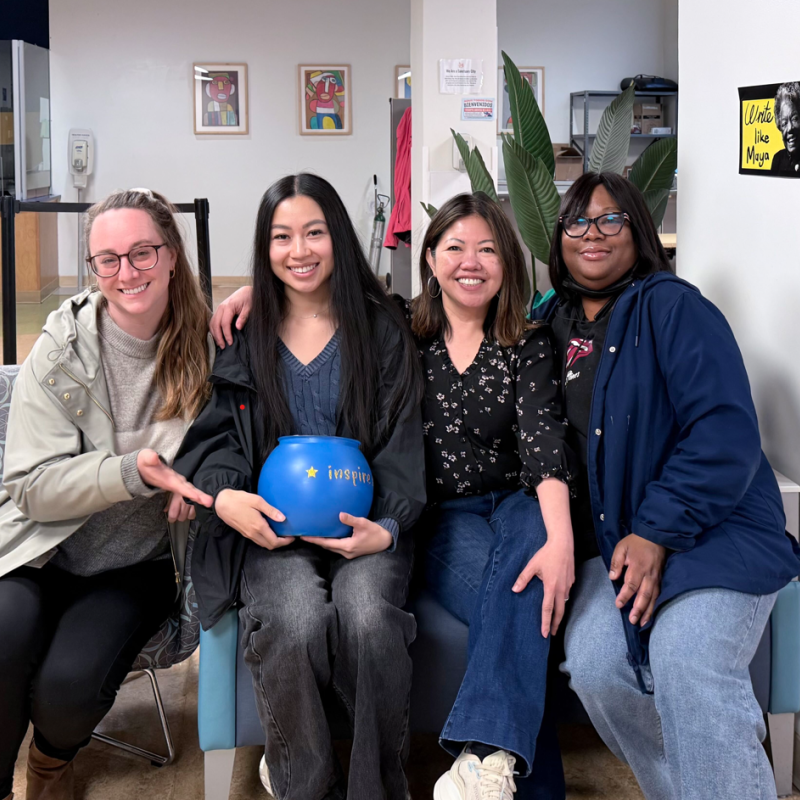 Pictured are Carolyn Ta and 3 coworkers seated on a sofa at the INSPIRE Clinic.